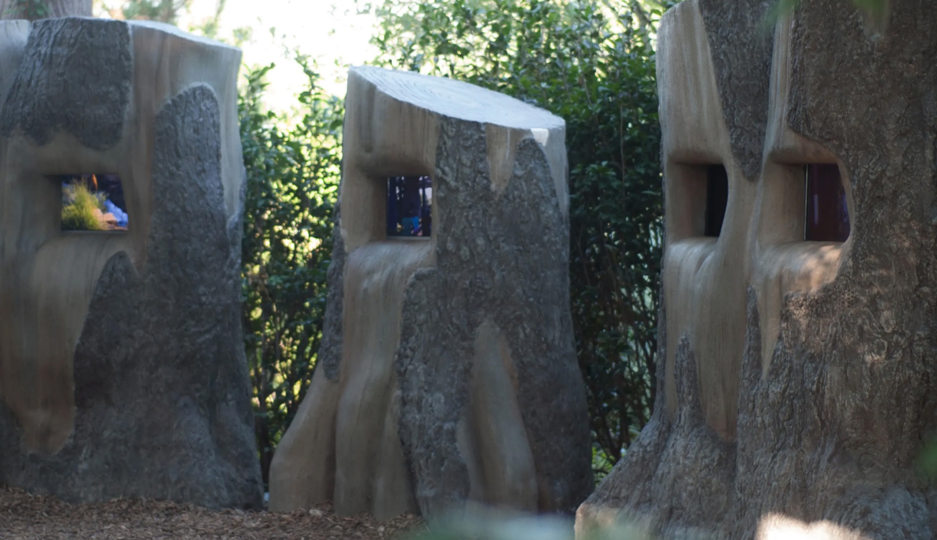Tree-stump touchscreen housings installed in the Children's Adventure Garden